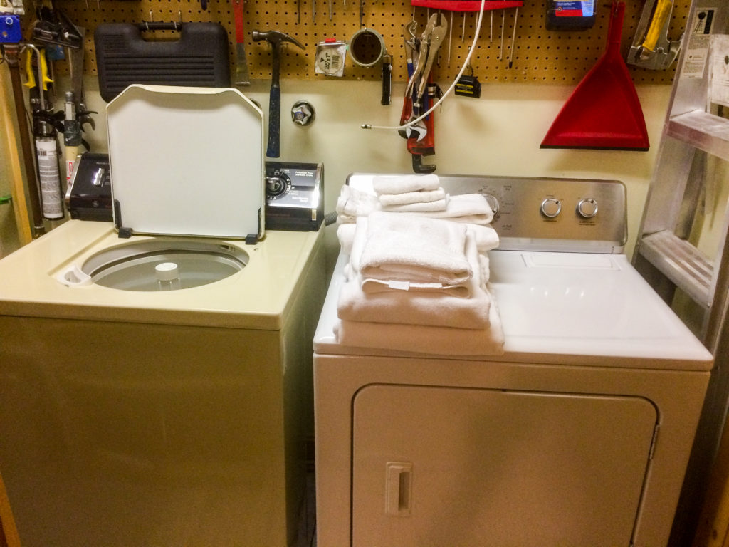 utility room with full sized washer and dryer