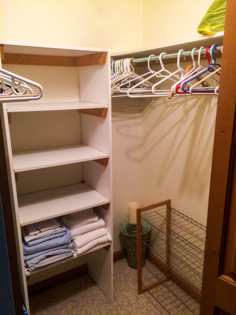 walk in closet with built in shelving